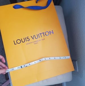Thin Louis Vuitton shopping bag
